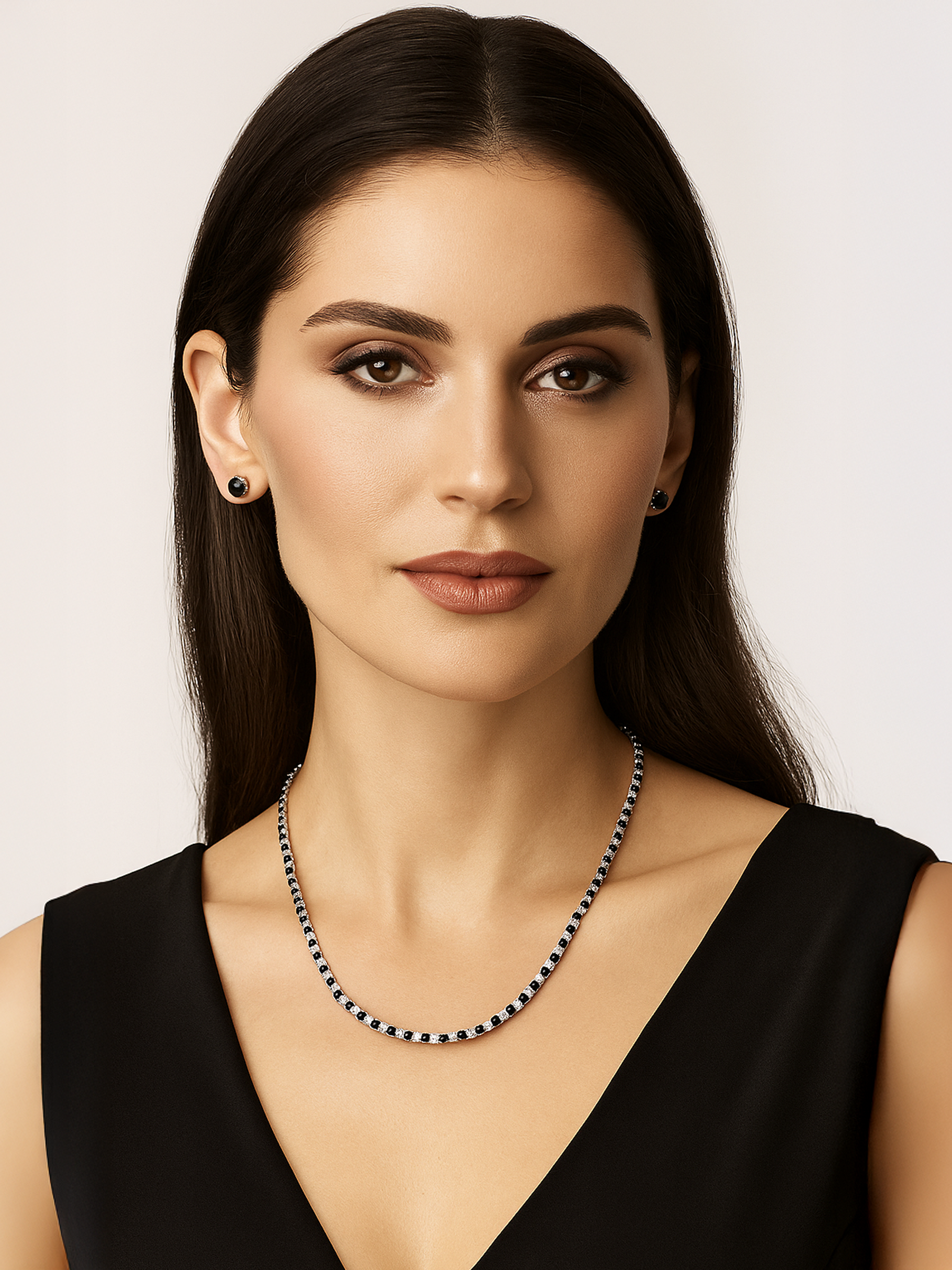 Woman wearing a black and white Tennis necklace