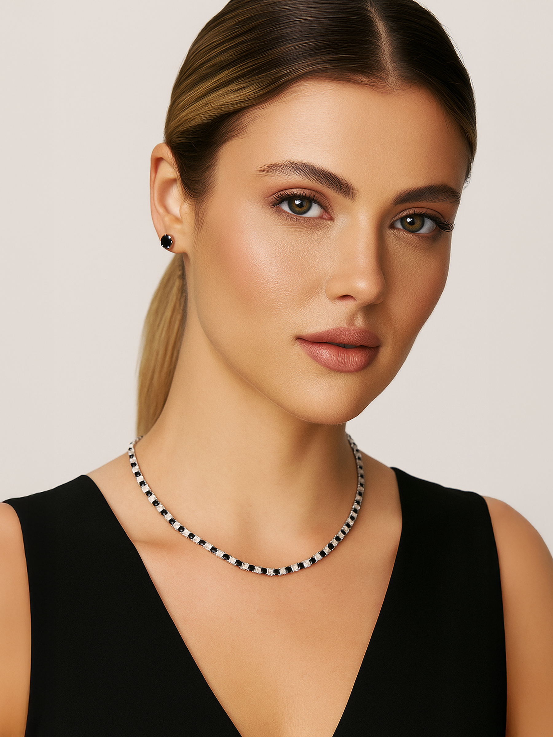 Woman wearing a black and white Tennis necklace