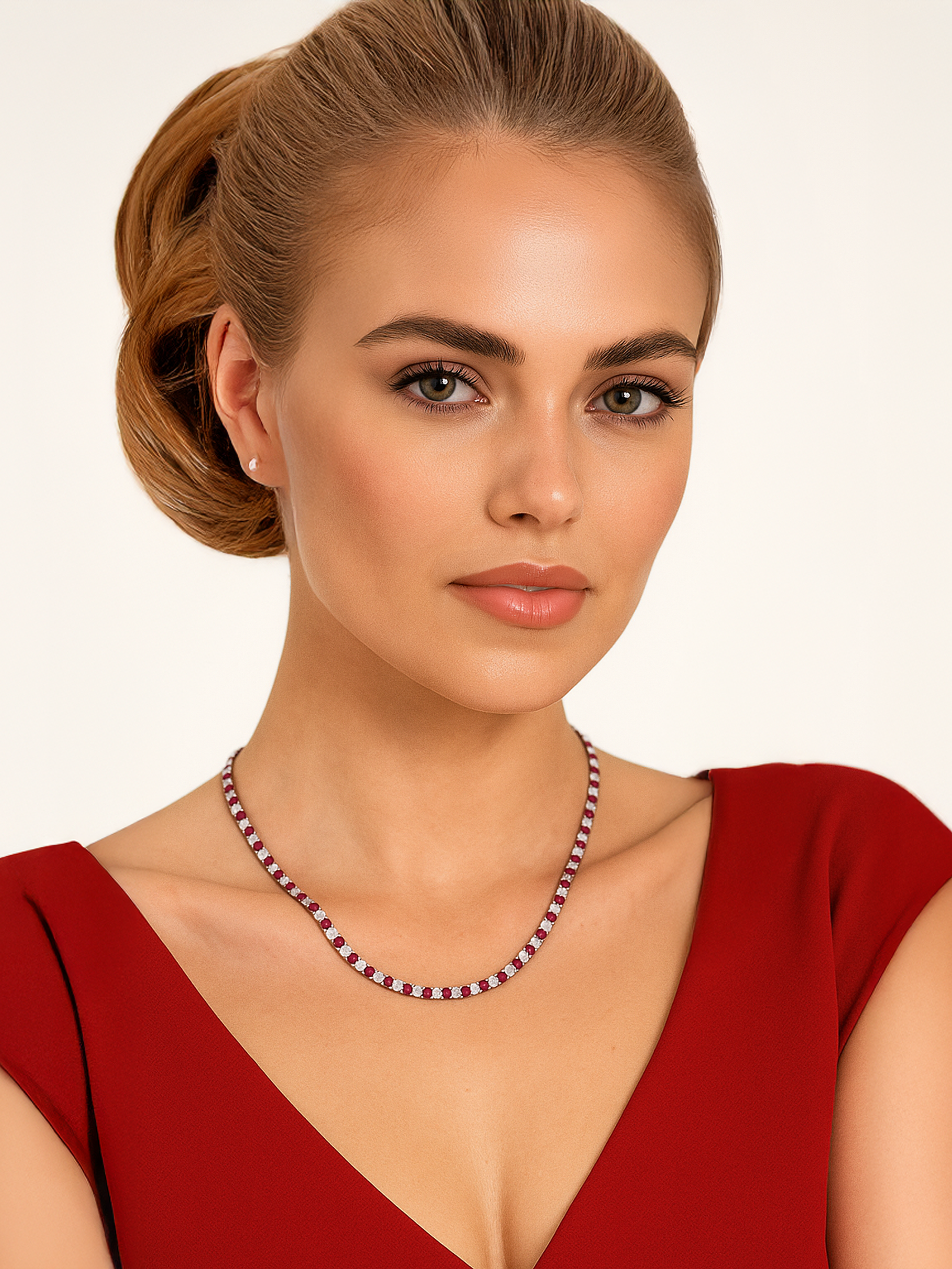 Woman wearing a red dress with red and white tennis necklace